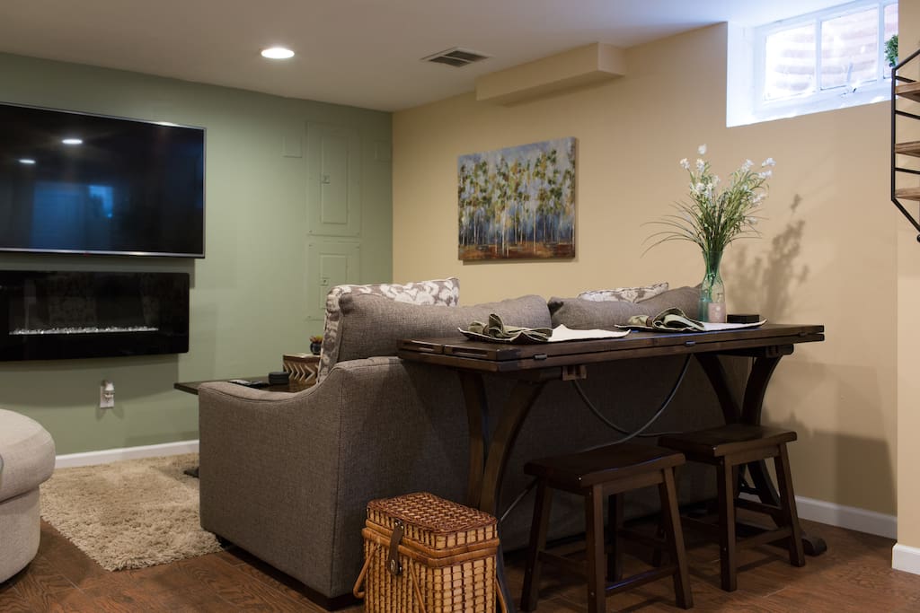 Sofa table with two bar stools and charging hub - perfect for enjoying meals or using as a workspace