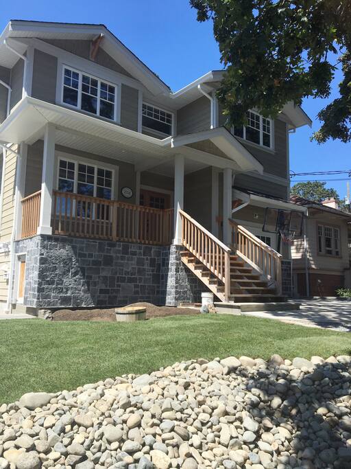 Beautifully landscaped front yard with cozy front porch