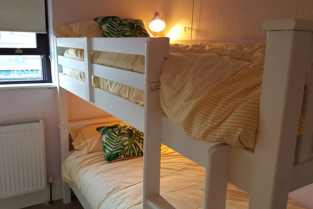 Bunk beds, each with own lamp