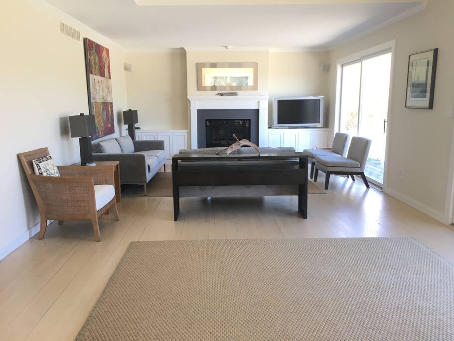 Living Room looking out onto pool deck and lawn