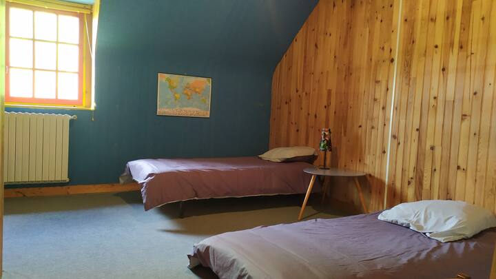 Upstairs bedroom with two single beds. 