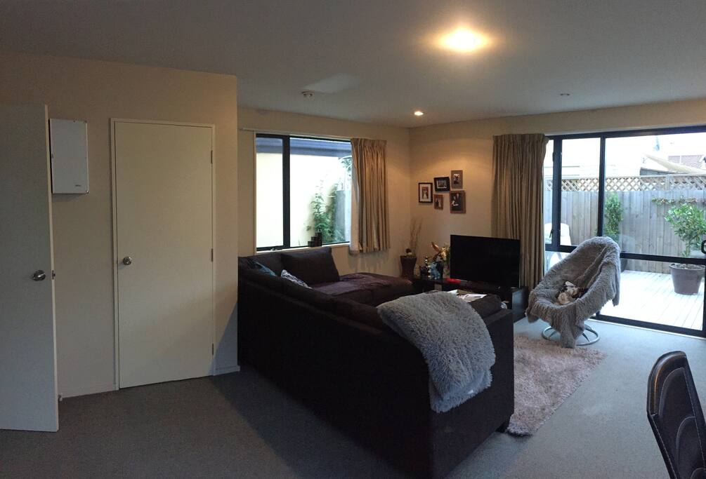 Communal lounge space + outdoor deck area.