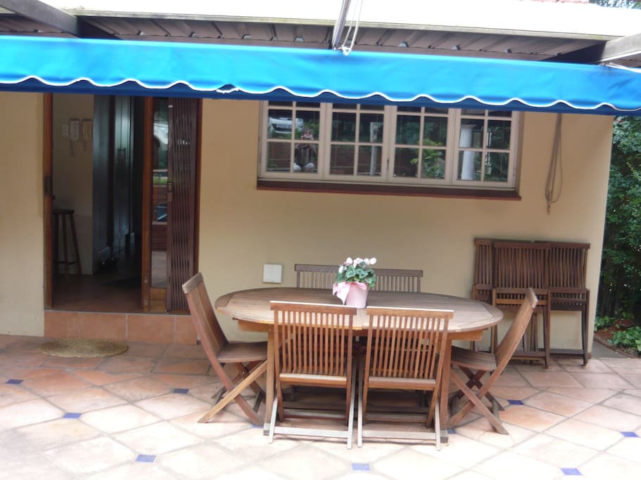 Patio with outdoor dining area and braai/barbeque