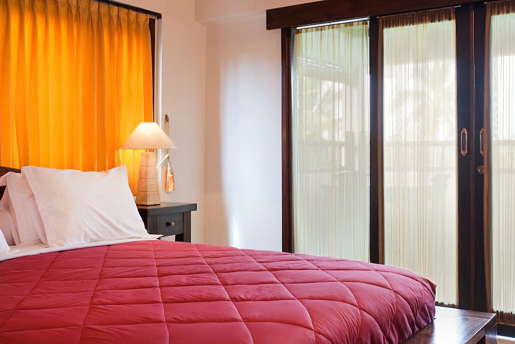 Entrance floor of your 2 story deluxe villa.. with private balcony, day bed table and chairs