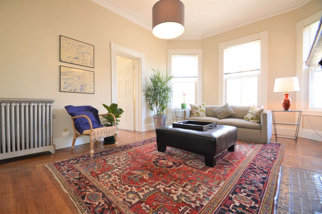 Relax in the sunny living room and enjoy views of the Armory!