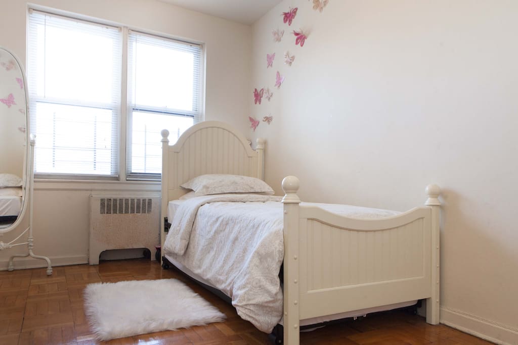 Private room with twin bed. Trundle twin mattress is underneath and rolls out completely to accommodate a second guest.