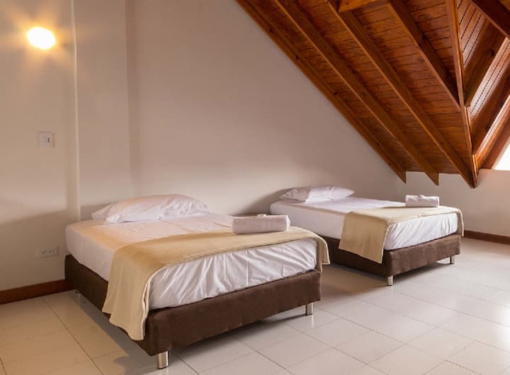 Second level room with two single beds