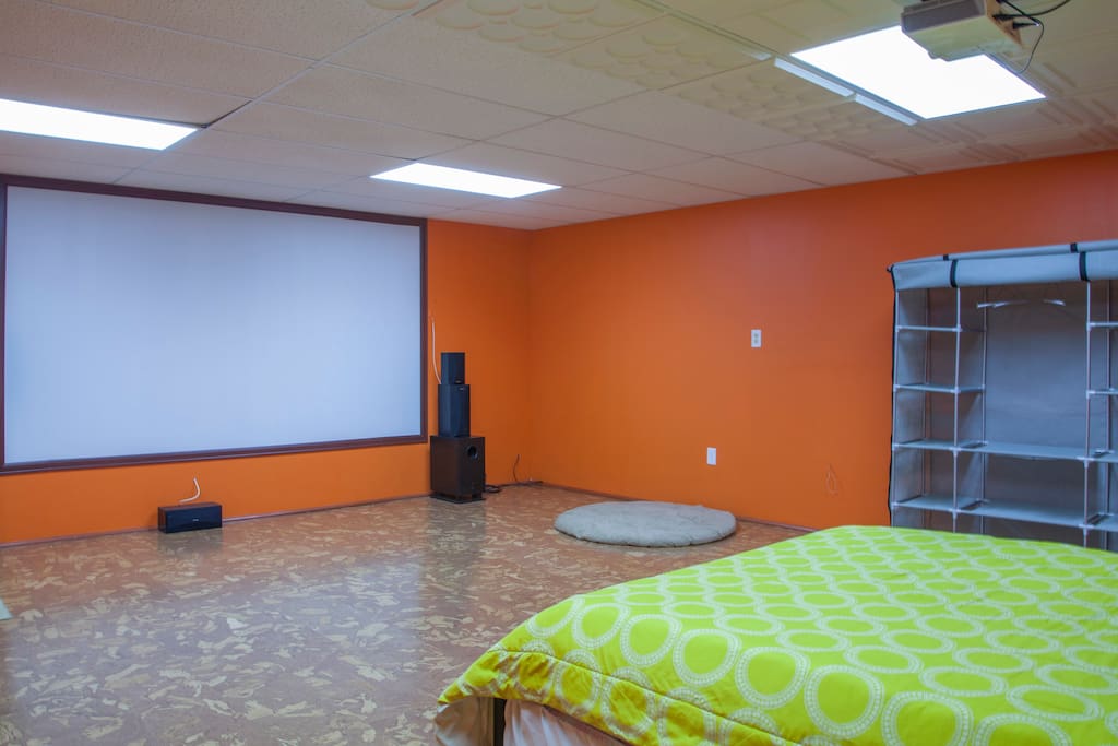 Bedroom and Home theatre with HDTV projector and surround sound system
