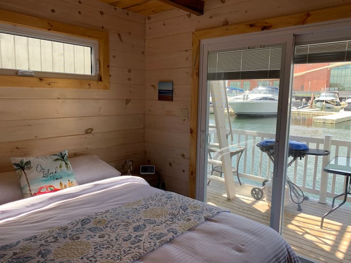 Imagine slowly waking up in this queen bed and enjoying the view through your patio door.