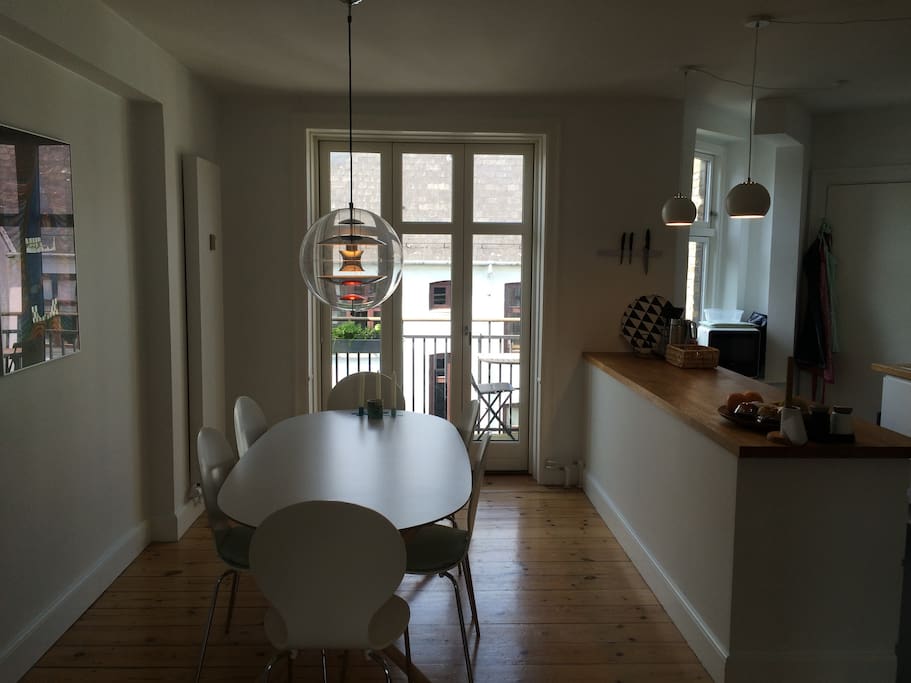 dining area in connection with kitchen and balcony