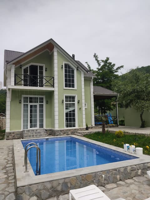 green villa with swimming pool in Ismailli