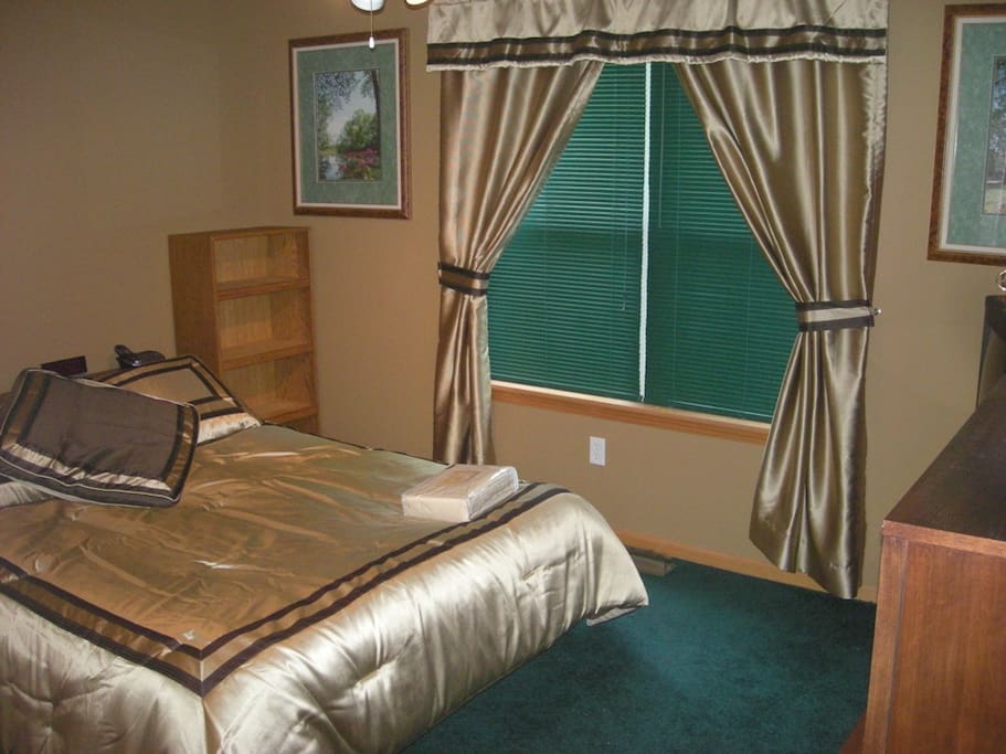 Guest Bedroom - view of a Forest from the back window.
