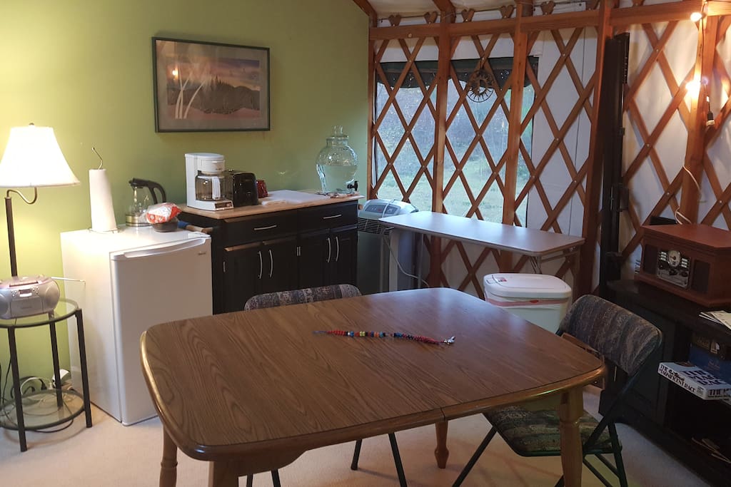Kitchenette includes refrigerator, coffee maker, hot water pot, toaster, utensils and dishes, coffee, tea, and other amenities.