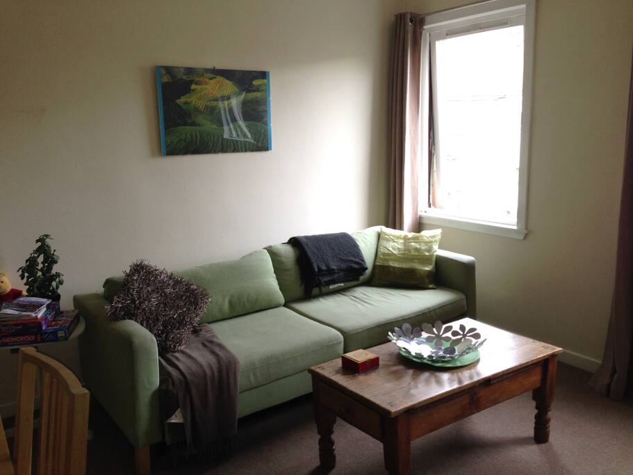 The other side of the living room. This sofa opens out into a double sofa bed
