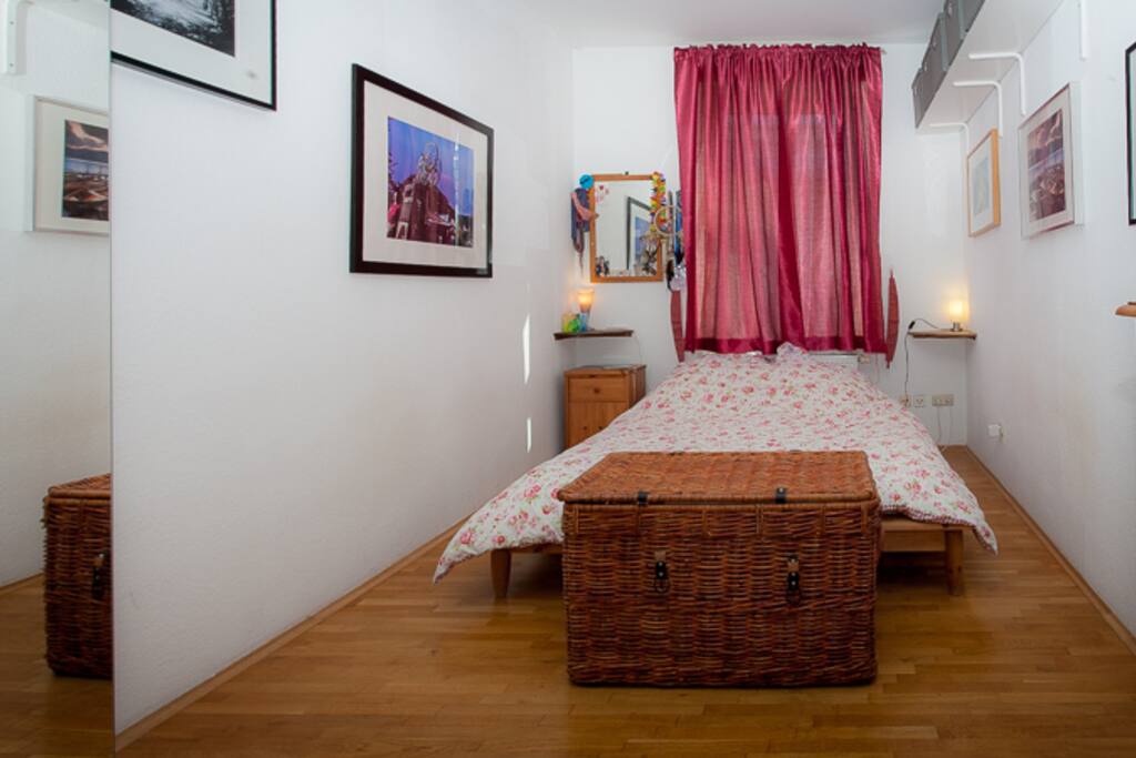King size bed in bright bedroom.
