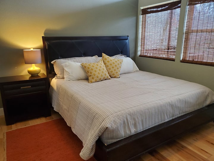 The guest bedroom also features a spacious and comfortable king bed. Topped with luxurious bedding and plush pillows. Guests often compliment us for our comfortable and cozy beds. 