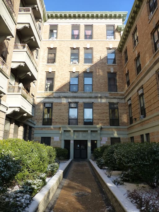 Entryway into the building. 4 front windows of second floor are my apt. windows.