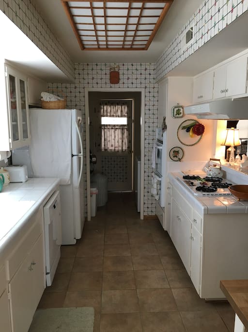 fully stocked kitchen and inside laundry space near back door
