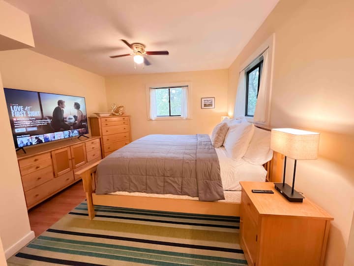 Main level bedroom with king size bed. 