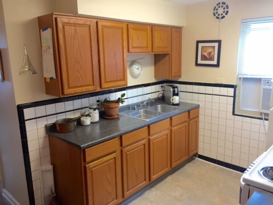 Great functional kitchen! Stove, microwave, and refrigerator included.
