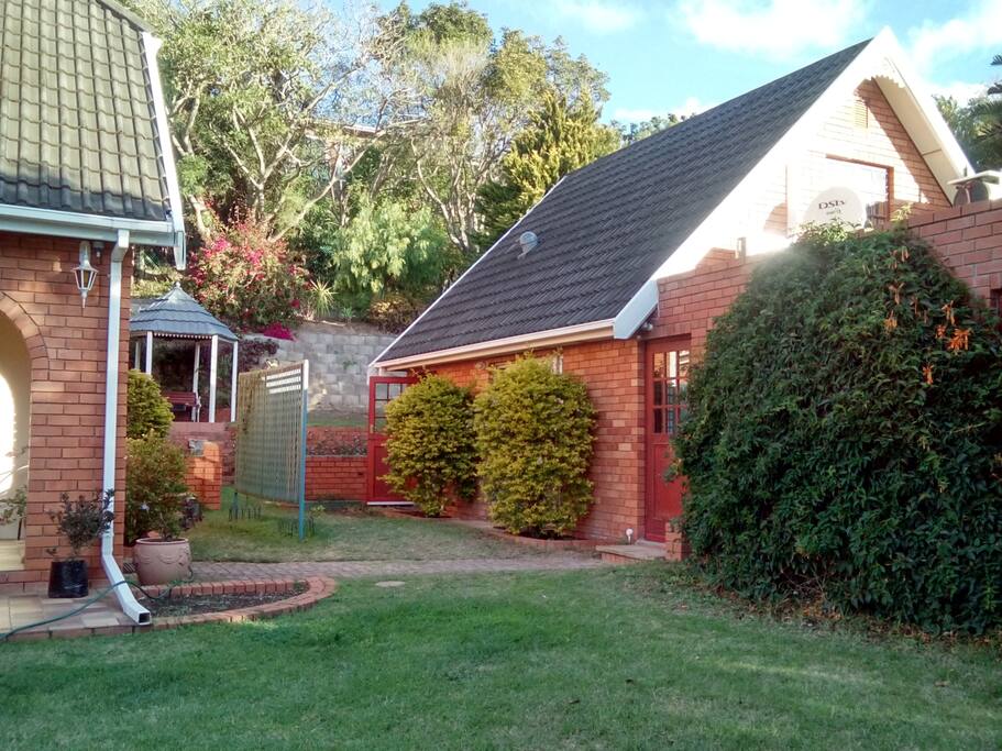 Lovemore Cottage in the garden beside the main house