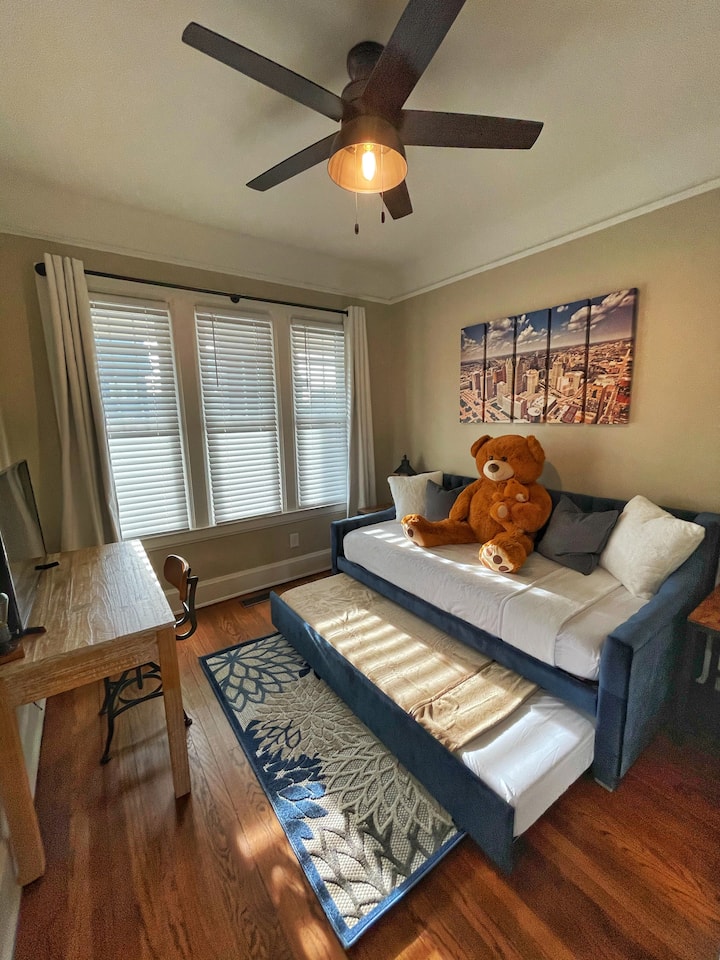 A trundle daybed is perfect for the kids, however the two twin-sized memory foam mattresses can fit averaged-sized adults as well (trust us, we tried it!)
