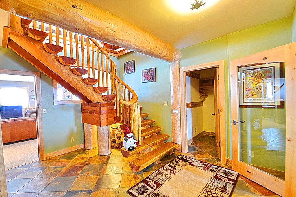 Enter through custom doors to the entry with over-sized closets to store all of your gear.