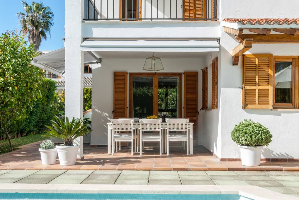 Private porched terrace by the pool, facing Bellver Castle's forest