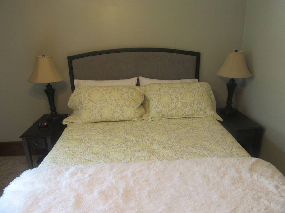 This room has two nightstands with electronic outlets on the backside of them