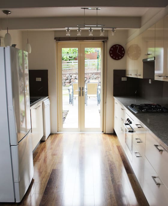 Galley Kitchen with french doors to Patio