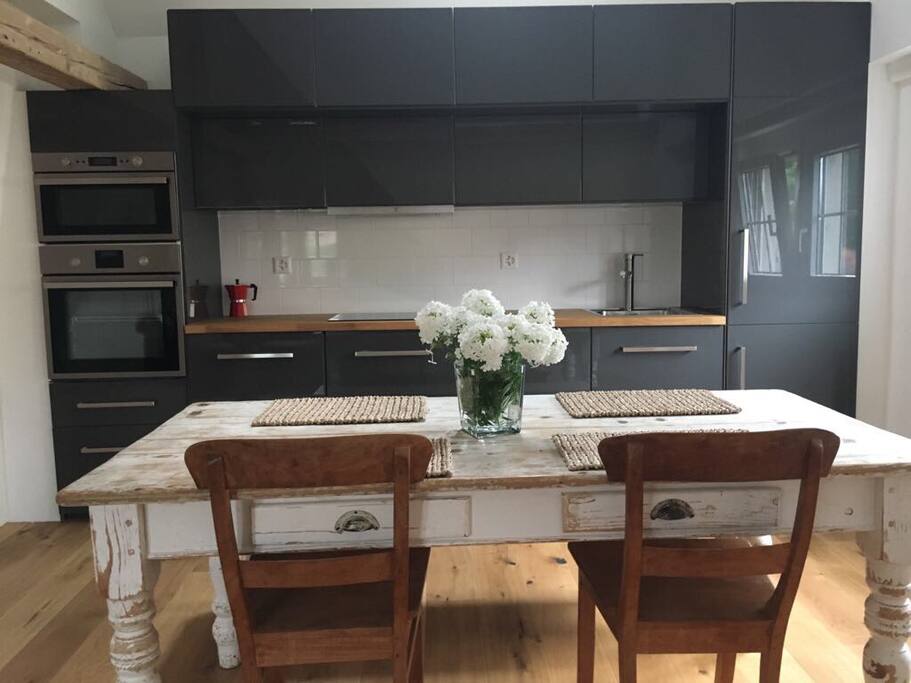 Fully equipped kitchen with fridge, freezer, hob, oven, microwave & dishwasher.