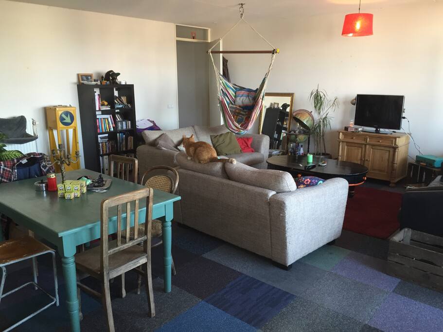 The living room with 3 comfy couches and two mattresses for extra 2 persons. Fully with Xbox, hammock chair and dining table.