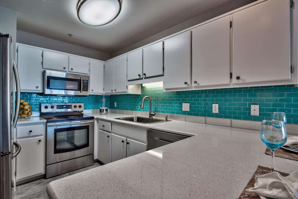 Fully remodeled kitchen with quartz counter tops and stainless steel appliances