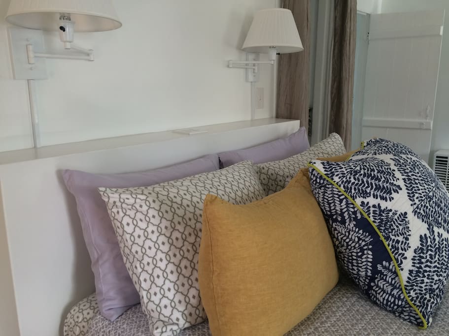 Lots of pillows, good reading lights and space at the head of the bed for the things you need, including built-in outlets for charging phones.