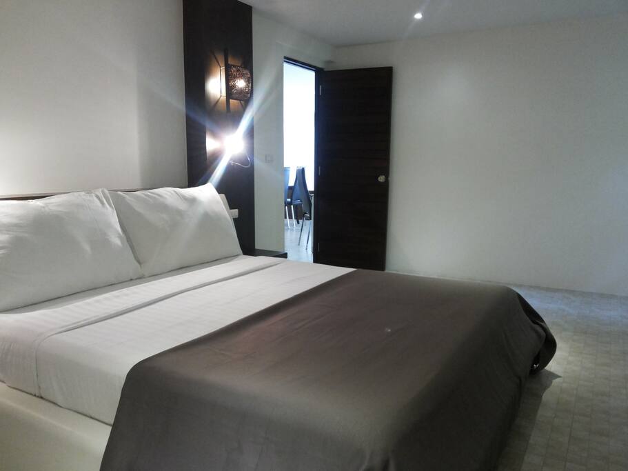 Mater room with window and furniture and bathroom