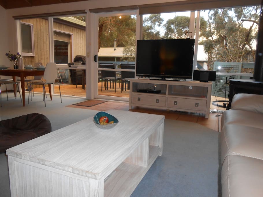 Lounge overlooks deck and native trees