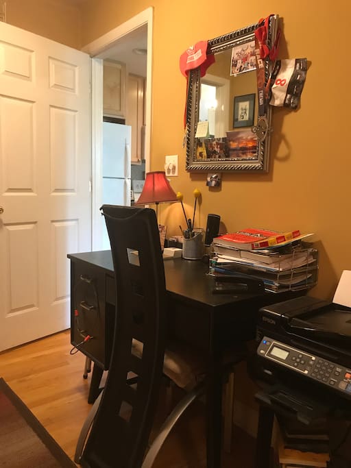 Desk with access to printer in the bedroom
