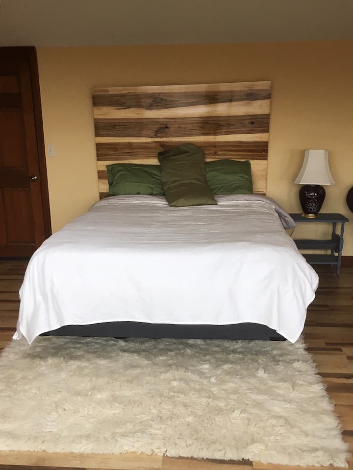 Queen sized bed in studio space - cotton sheets / flannel when it's cold
Patrick made the headboard