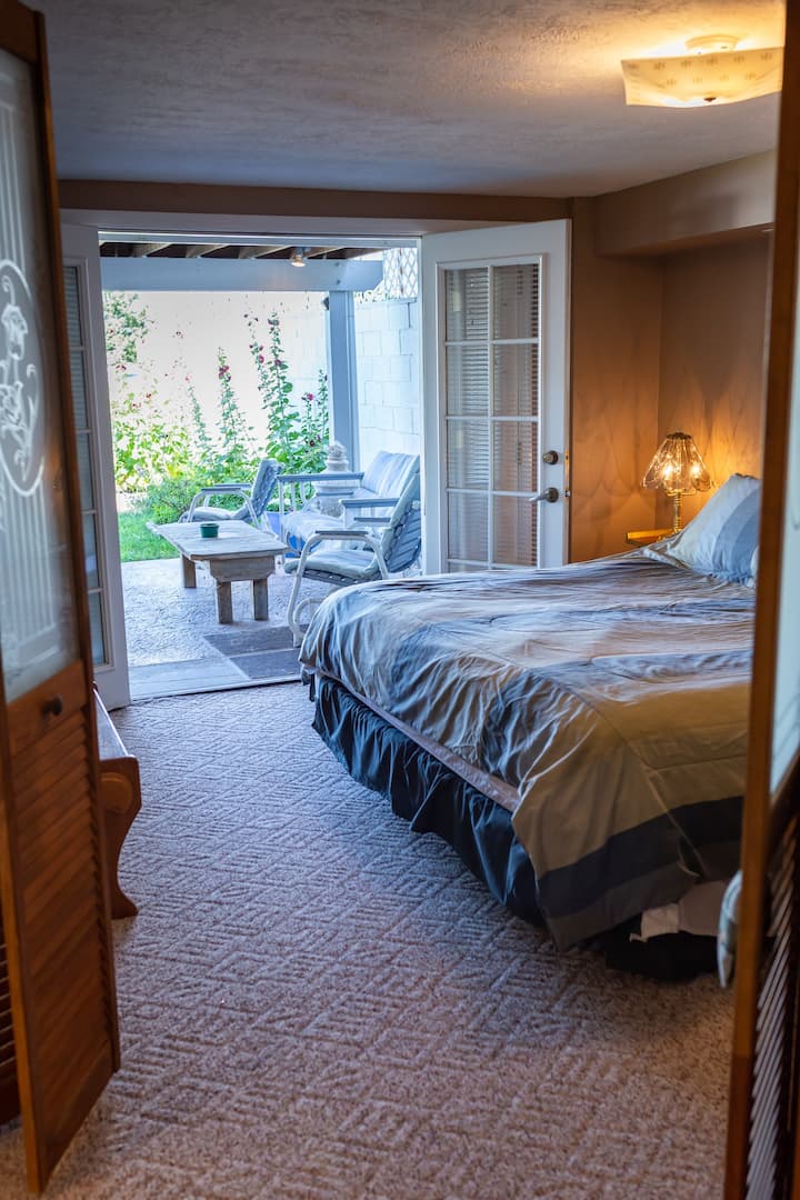 Bedroom 2 has french doors and access to the private patio, making it a favorite for many guests.