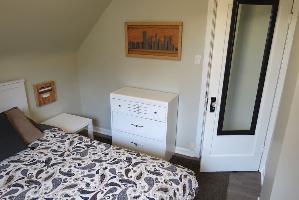 Large Closet with Hangers, Dressers, and Tables provided