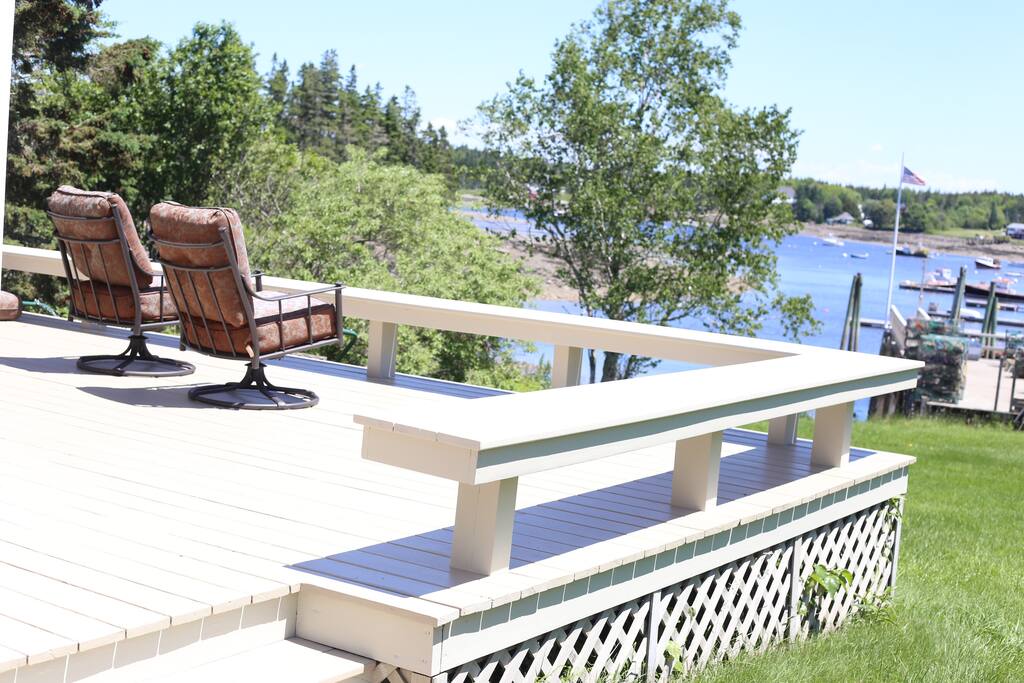 Relax on the deck facing the harbor activity