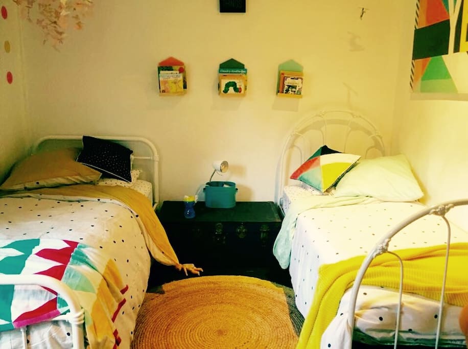 Children's room. Has fan, double open windows. Lots of toys too! Could be used for small adults.