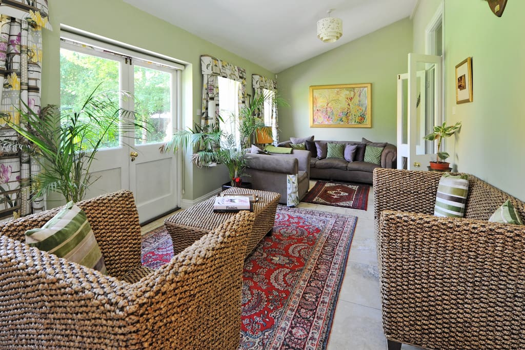 The living room has french doors opening to the garden.