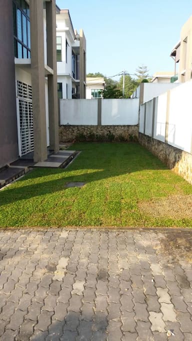 Dry area beside the garden that suitable for BBQ and family activities