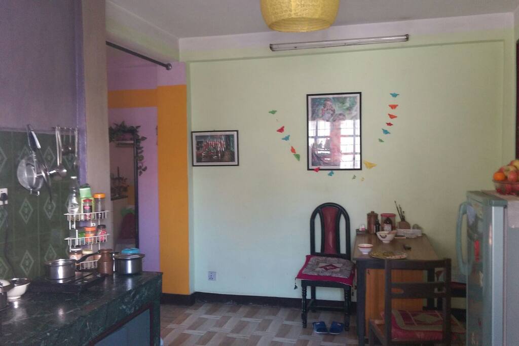 Kitchen and dining with some traditional photo collections .
