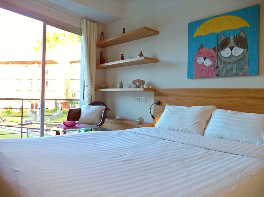 Stylish room with pool and sea view