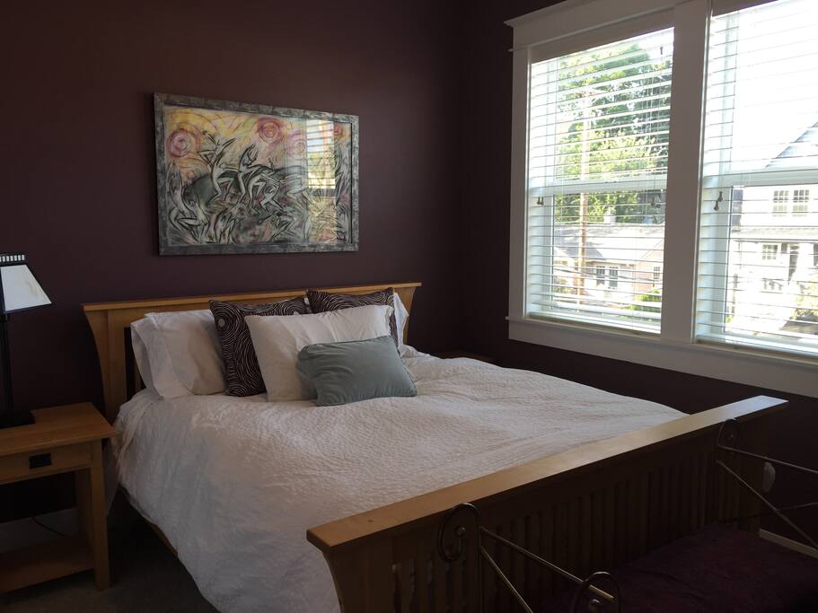 Comfy, private upstairs bedroom with queen bed, along with iron and ironing board in the closet
