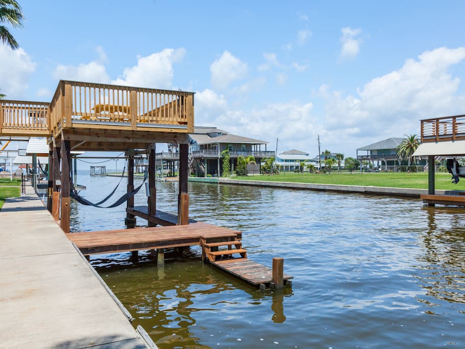 Dip your toes in the water from home's private dock.