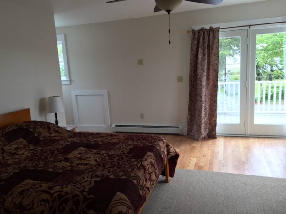 Second floor bedroom with a bathroom as part of this master suite. You'll also have direct access to the small deck right outside of the bedroom!