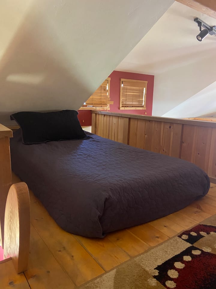 Twin bed in loft. Low ceiling 
